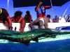 participants on boat with ray